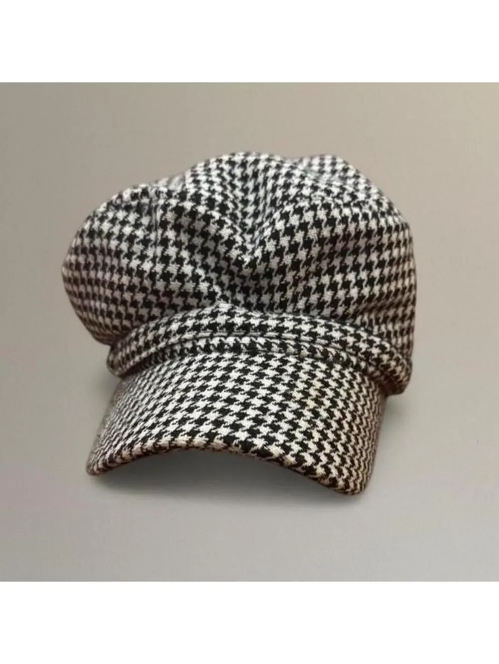 Houndstooth newsboy cap.